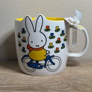 Miffy By Magenta Bunny On A Bike With Flowers Ceramic Mug Yellow Interior NWT